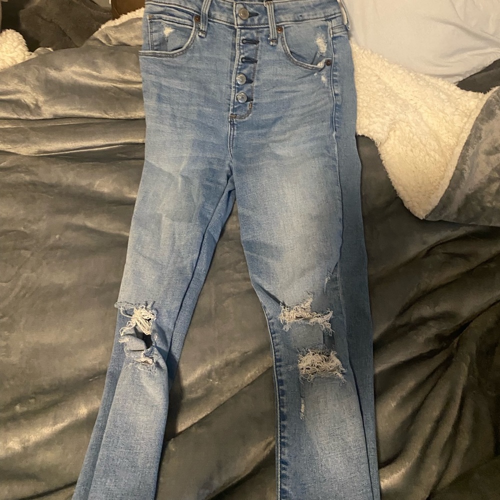 ripped jeans with 4 buttons